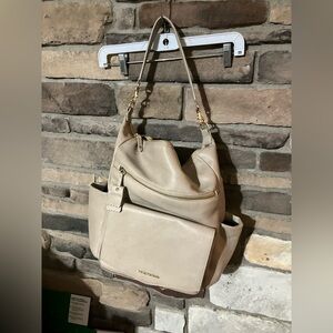 Twelve little PEEK-A-BOO VEGAN LEATHER CONVERTIBLE HOBO BACKPACK IN LATTE